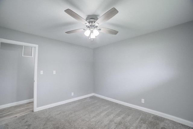 1978 Fleming St, Watseka, IL 60970 - carpeted empty room featuring baseboards and a ceiling fan