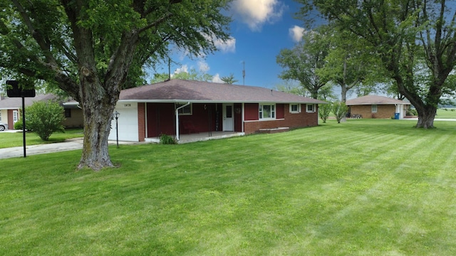 1978 Fleming St, Watseka, IL 60970 - view of front of home with a front lawn, brick siding, and a garage