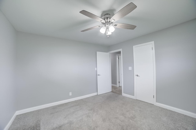 1978 Fleming St, Watseka, IL 60970 - spare room with carpet floors, ceiling fan, and baseboards