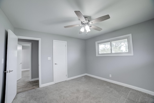 1978 Fleming St, Watseka, IL 60970 - unfurnished bedroom featuring carpet floors, baseboards, and a ceiling fan
