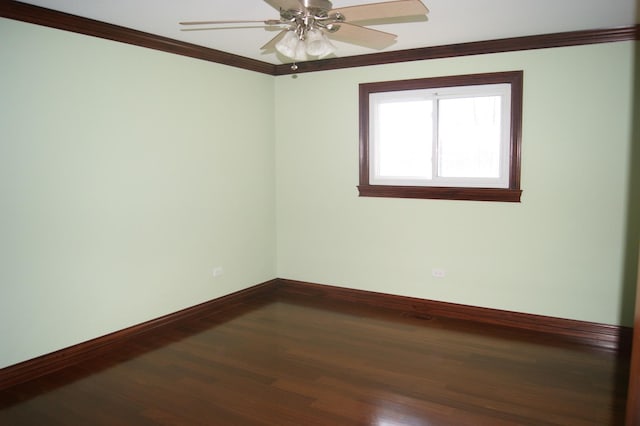 unfurnished room featuring dark wood-style floors, crown molding, baseboards, and a ceiling fan