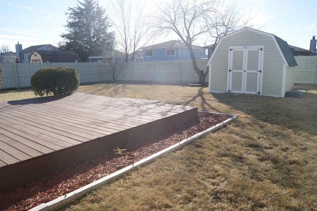 exterior space with a shed, a lawn, an outdoor structure, and a fenced backyard