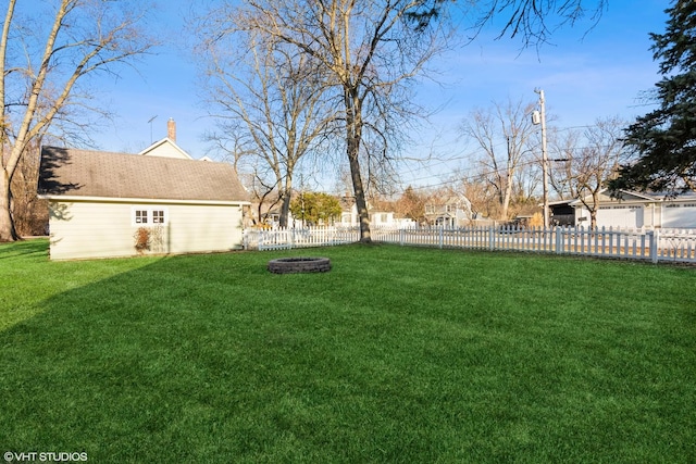 view of yard featuring fence private yard and a fire pit