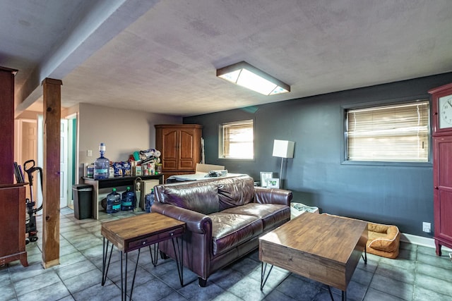 living area featuring baseboards