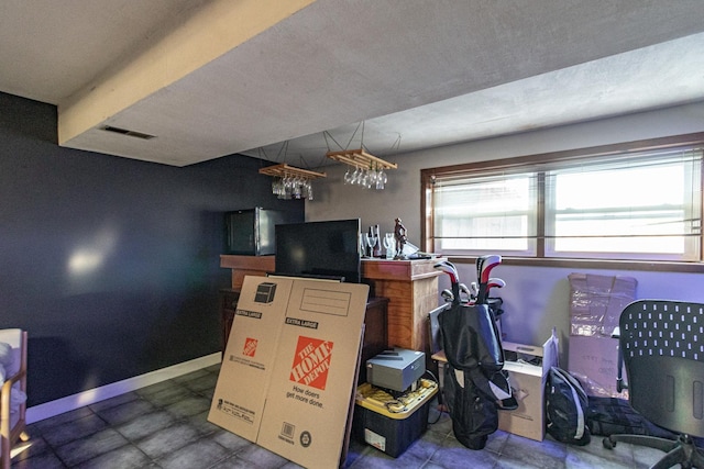 playroom featuring baseboards and visible vents