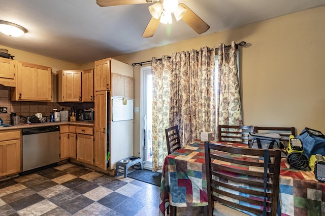 kitchen featuring ceiling fan, dark floors, stainless steel dishwasher, decorative backsplash, and light brown cabinetry