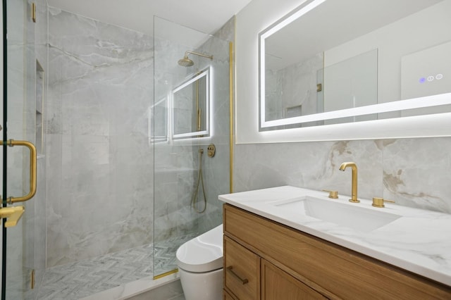 full bathroom with decorative backsplash, toilet, vanity, and a marble finish shower