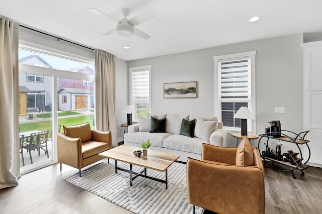 living room featuring a ceiling fan, wood finished floors, and recessed lighting