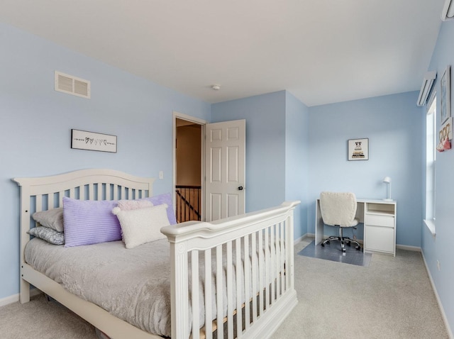 bedroom featuring baseboards, visible vents, and carpet flooring