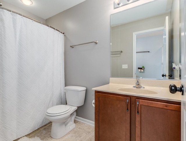 full bathroom featuring tile patterned flooring, vanity, toilet, and baseboards