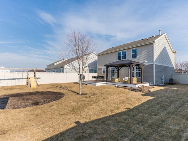 back of house featuring a gazebo, a yard, cooling unit, and a fenced backyard