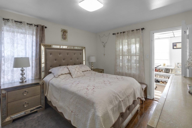 bedroom featuring dark wood-type flooring