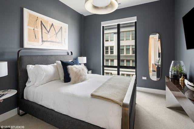 carpeted bedroom with baseboards