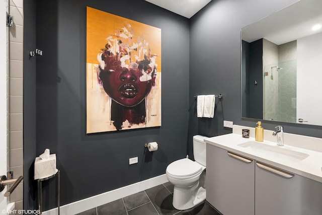 full bathroom featuring vanity, baseboards, a tile shower, tile patterned floors, and toilet