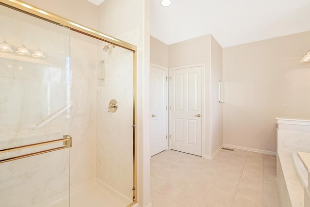 bathroom with baseboards and a marble finish shower