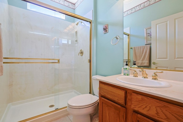 full bathroom with a stall shower, vanity, toilet, and tile patterned floors