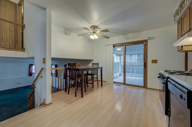 interior space with ceiling fan, light wood-style flooring, and baseboards