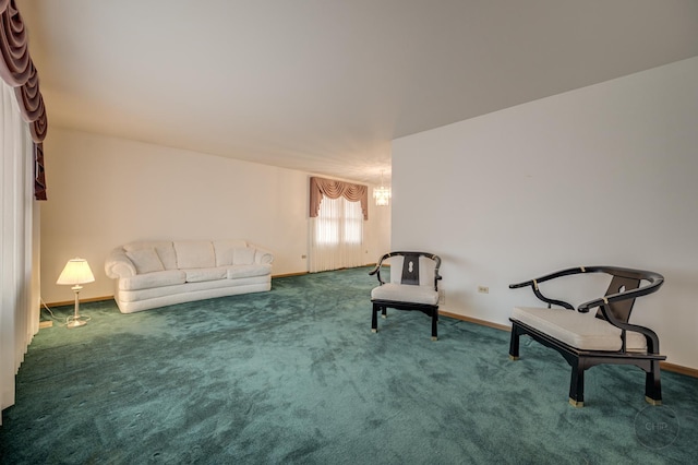 living area featuring carpet and baseboards