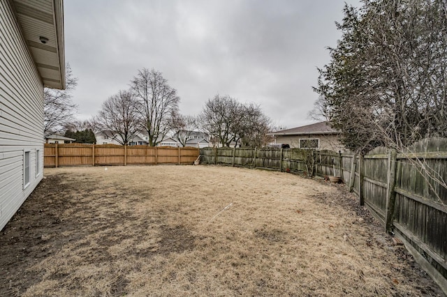 view of yard featuring a fenced backyard