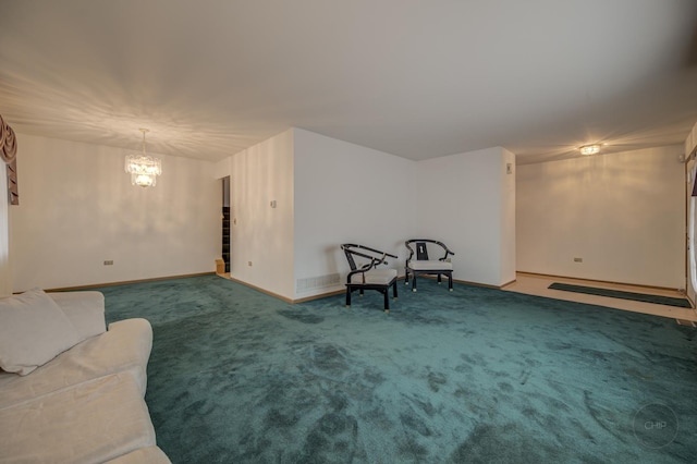 unfurnished room featuring carpet floors, a notable chandelier, and baseboards