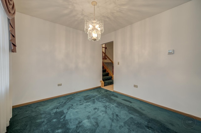 empty room with a chandelier, carpet floors, stairway, and baseboards