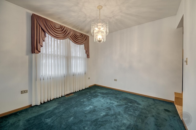 spare room with carpet flooring, visible vents, baseboards, and an inviting chandelier