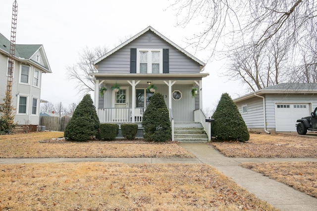 bungalow with a garage and a porch