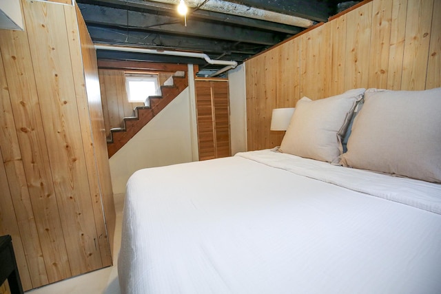 bedroom with wooden walls