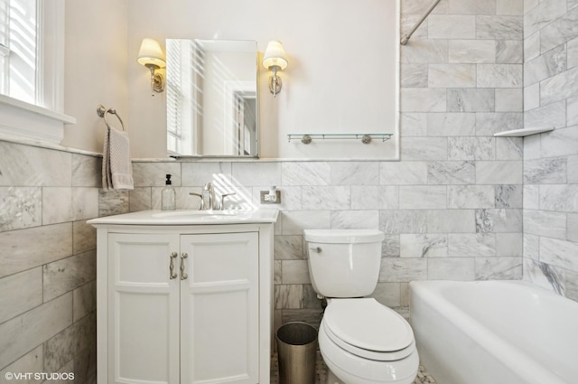 full bathroom featuring toilet, tile walls, and vanity