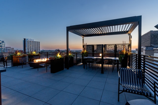 view of patio featuring a fire pit and a pergola