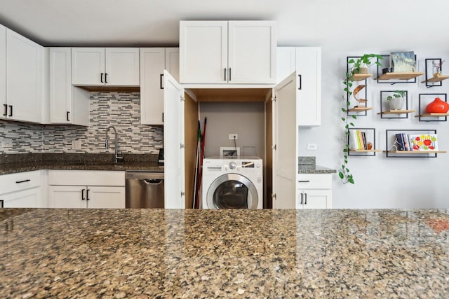 kitchen with washer / clothes dryer, decorative backsplash, a sink, dark stone counters, and dishwasher