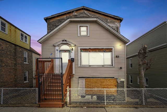 view of front of home featuring fence