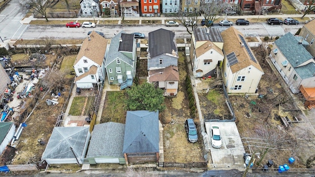 birds eye view of property with a residential view