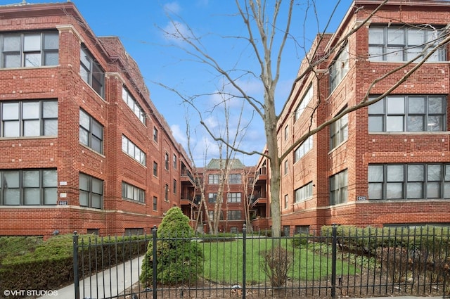 view of building exterior featuring fence