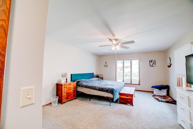 bedroom with ceiling fan, baseboards, and carpet