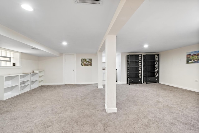 below grade area with carpet, visible vents, baseboards, and recessed lighting