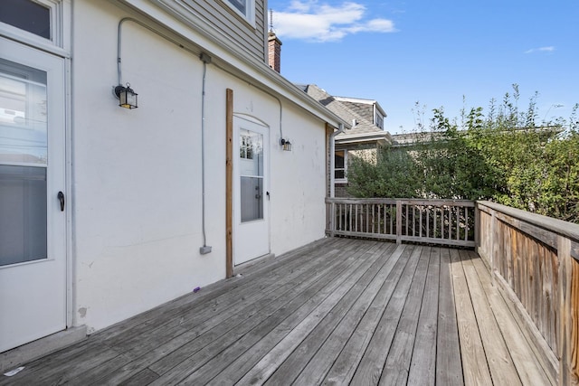 wooden deck with a garage