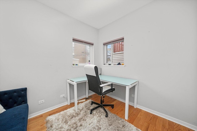 office with baseboards and wood finished floors