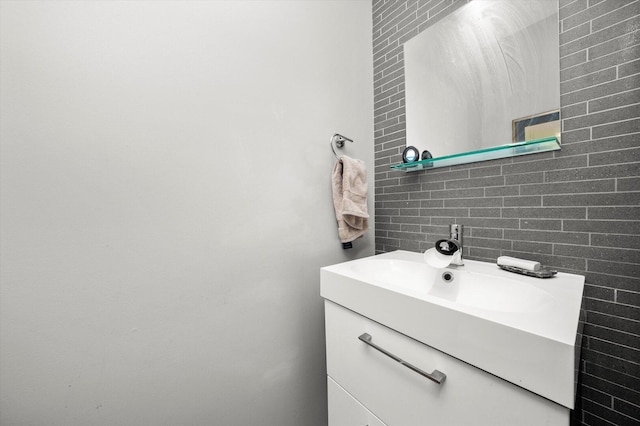 bathroom with tile walls, backsplash, and vanity