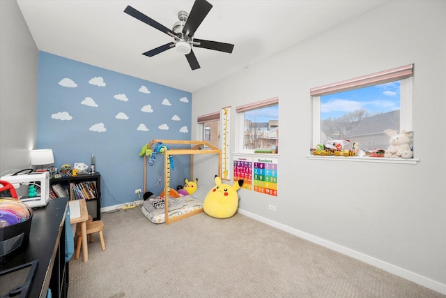 interior space with ceiling fan and baseboards