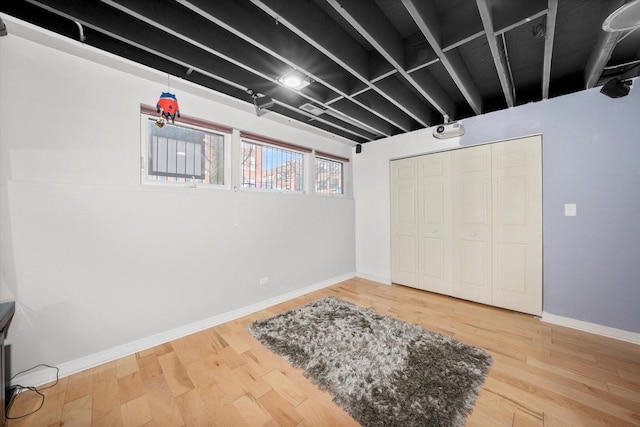 interior space featuring visible vents, baseboards, and wood finished floors