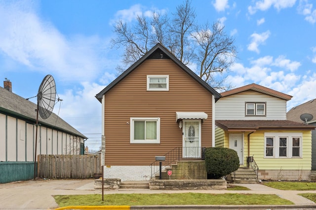 view of front of house with fence