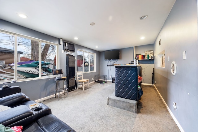 living area featuring carpet floors, recessed lighting, baseboards, and a wall mounted AC