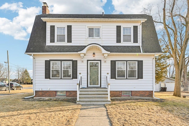 view of front of house featuring a shingled roof, a chimney, a front lawn, and central AC unit