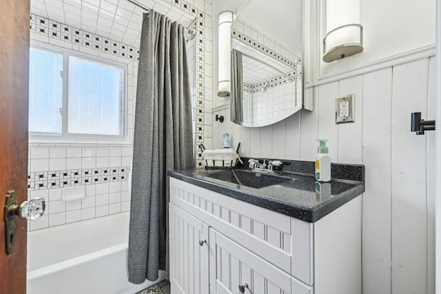 bathroom featuring shower / bathtub combination with curtain and vanity