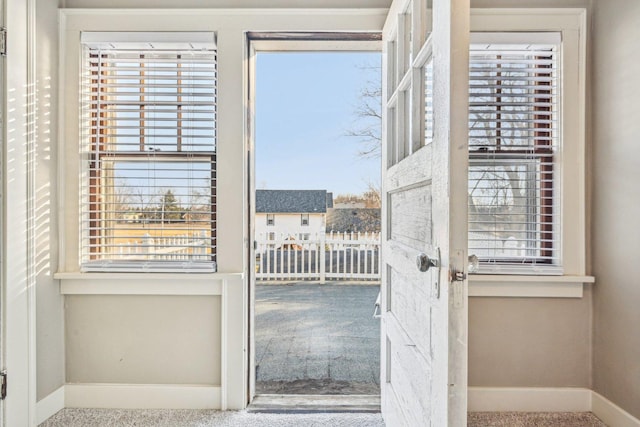 entryway featuring a healthy amount of sunlight and baseboards