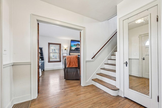 interior space with baseboards and hardwood / wood-style flooring