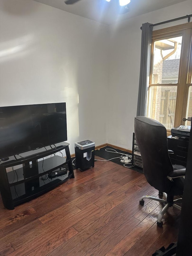 home office with baseboards and hardwood / wood-style flooring