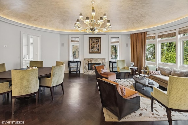 interior space with a fireplace and an inviting chandelier