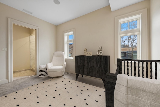 bedroom with carpet floors, baseboards, and visible vents